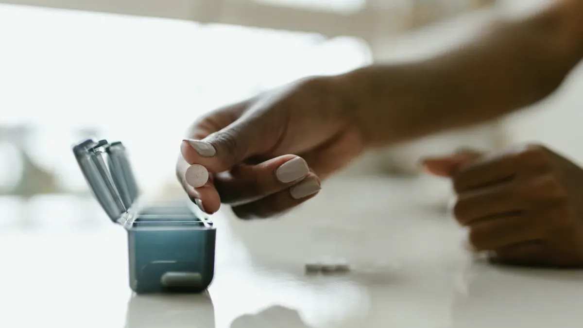 A dog owner's hands offering a supplement chew treat to a medium-sized dog