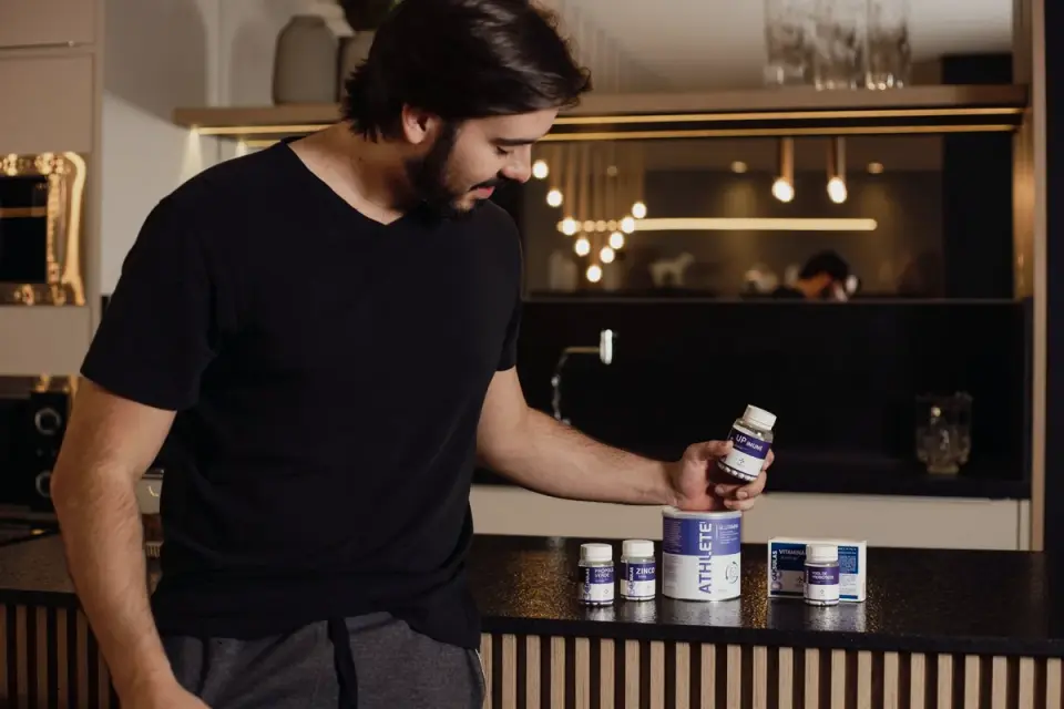 A veterinarian and a dog owner reviewing a supplement label together in an exam room
