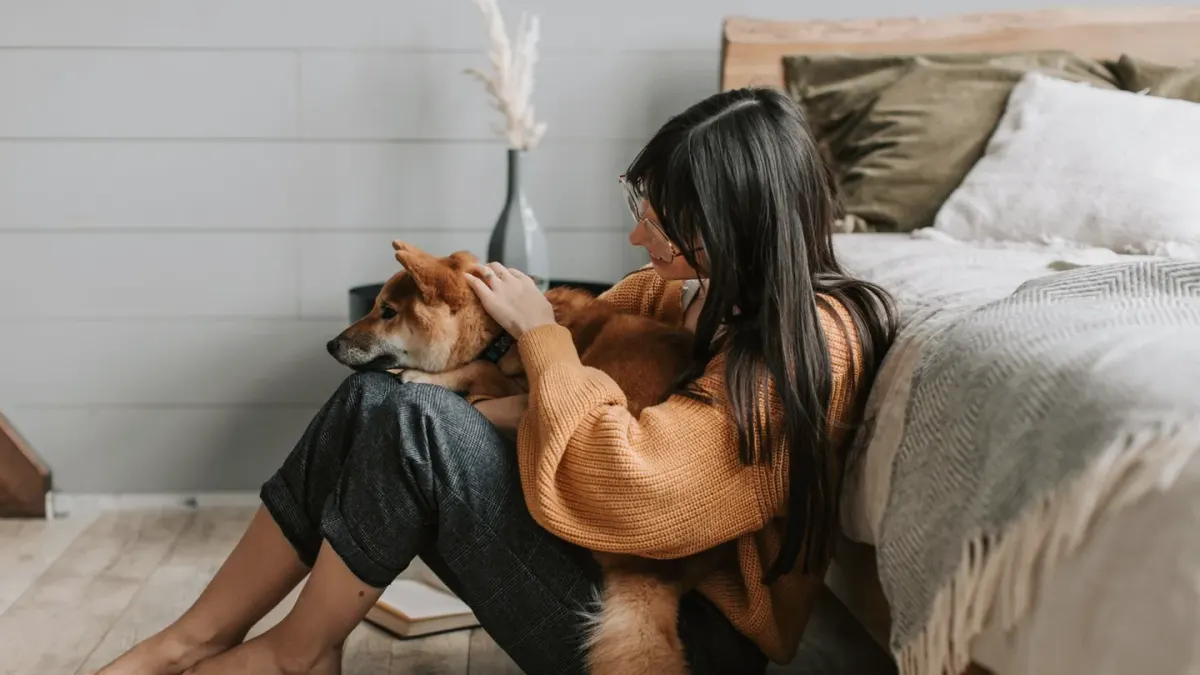 Dog owner at home