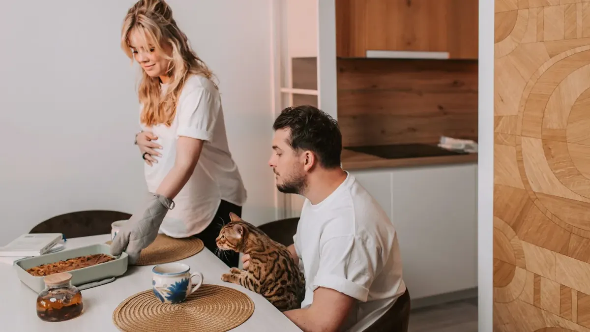 Dog owner preparing dog food kitchen