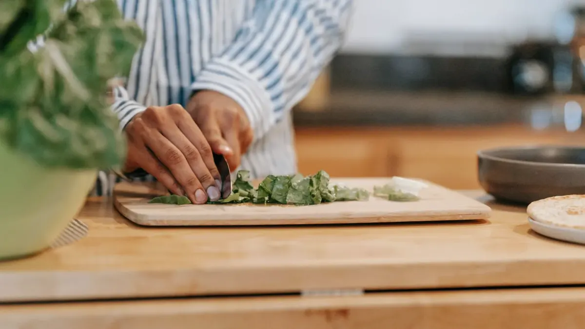 Dog owner preparing dog food kitchen