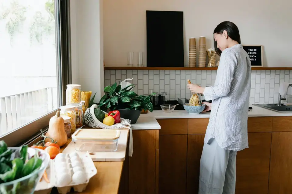 Dog owner preparing dog food kitchen