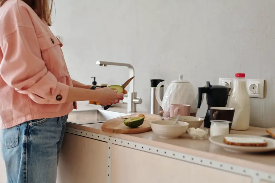 Dog owner preparing dog food kitchen