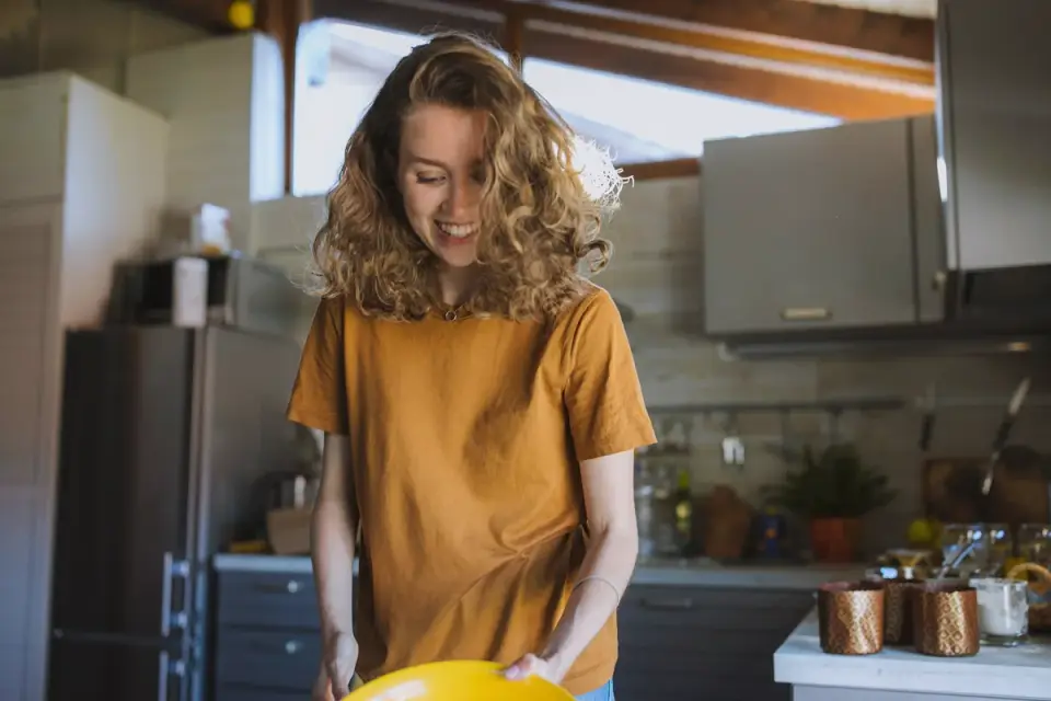 Dog owner preparing dog food kitchen