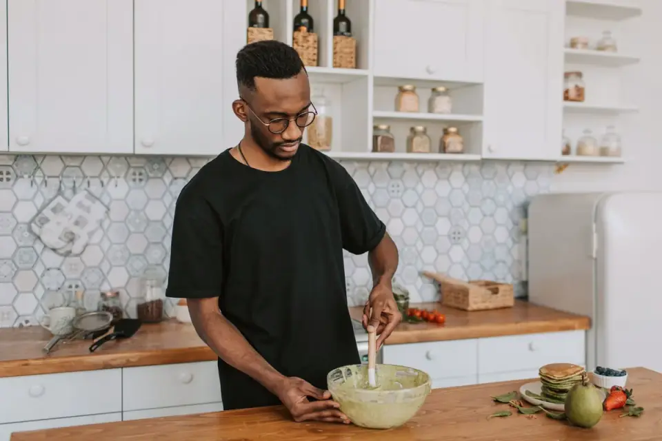 Dog owner preparing dog food kitchen