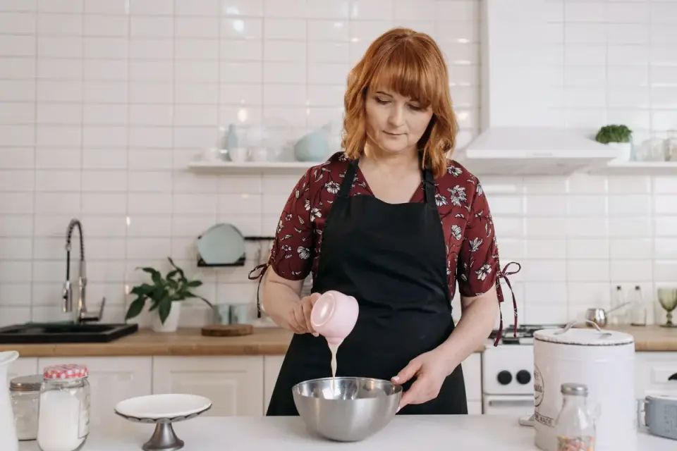 Dog owner preparing dog food kitchen