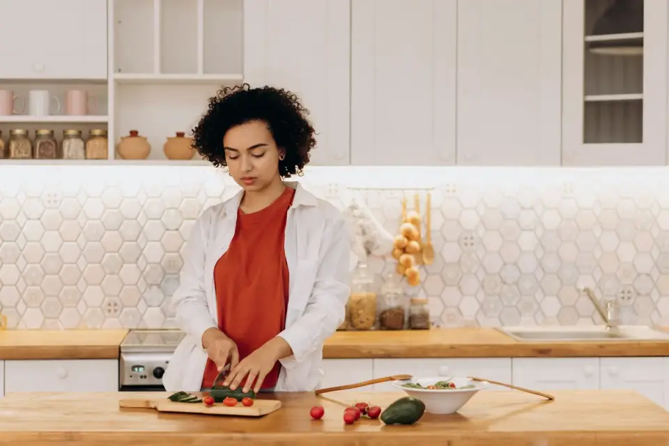 Dog owner preparing dog food kitchen