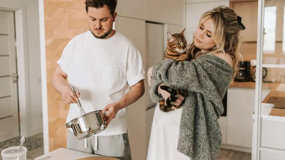 Dog owner preparing dog food kitchen