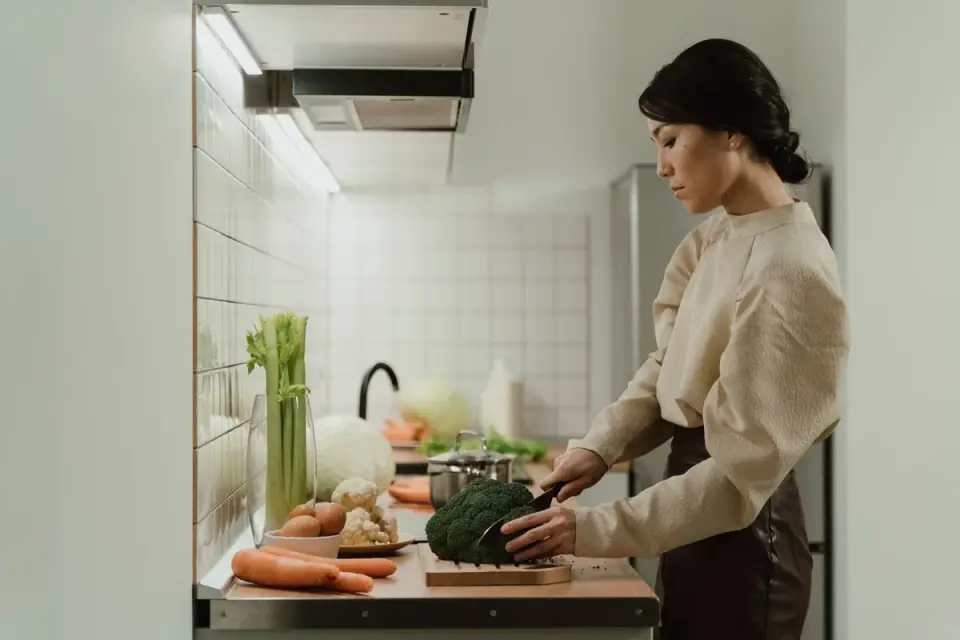 Dog owner preparing dog food kitchen
