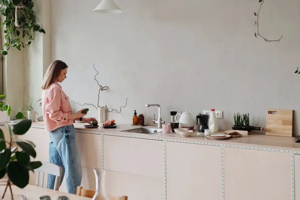 Dog owner preparing dog food kitchen
