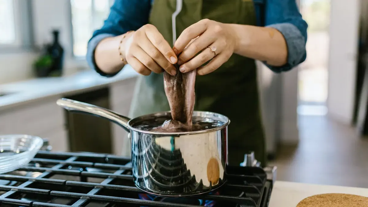 Dog owner preparing dog food kitchen