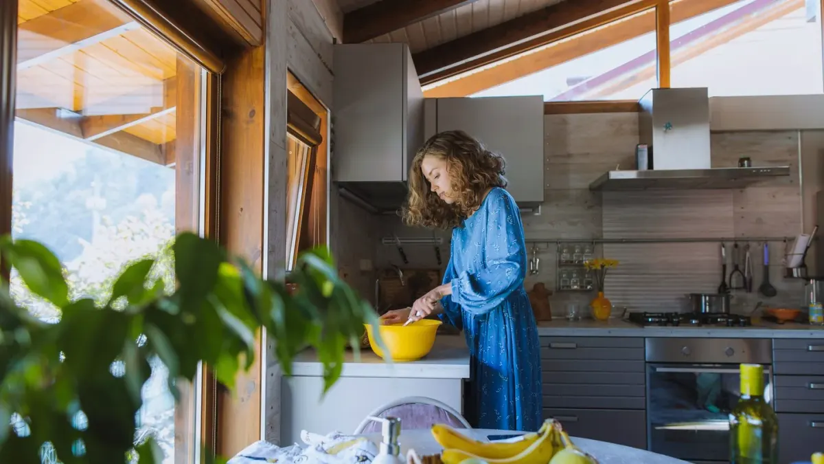 Dog owner preparing dog food kitchen