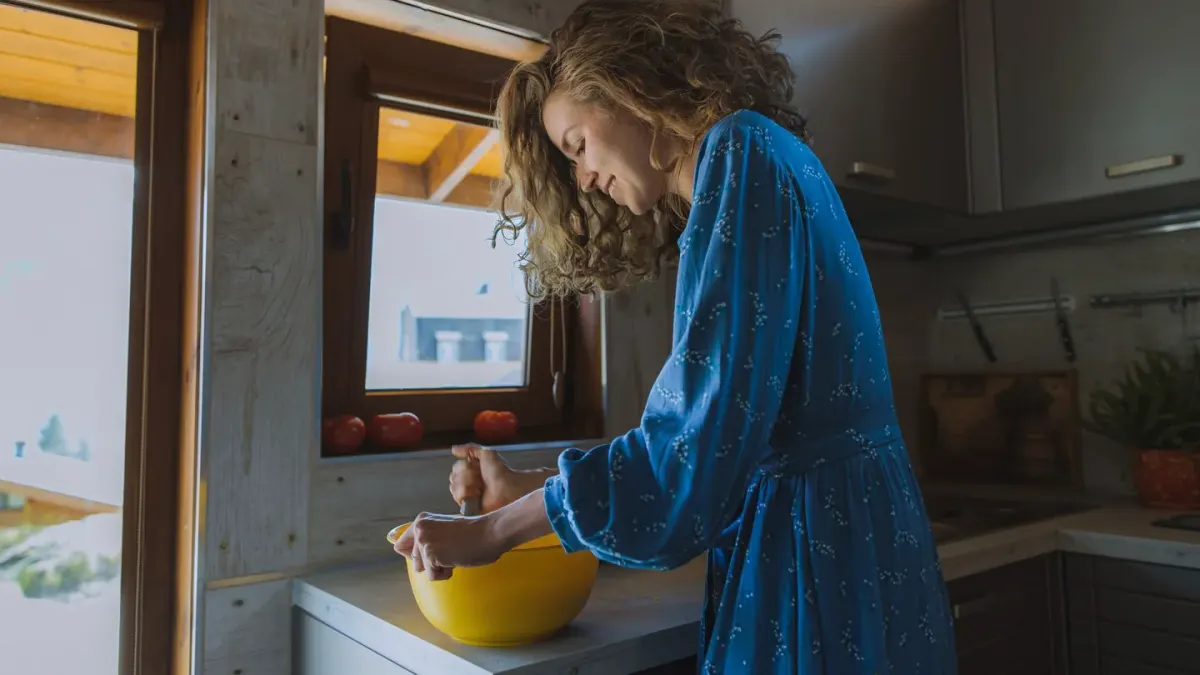 Dog owner preparing dog food kitchen