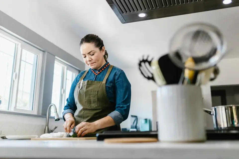 Dog owner preparing dog food kitchen