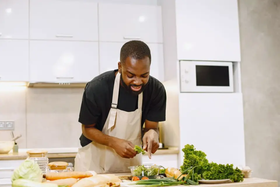 Dog owner preparing dog food kitchen
